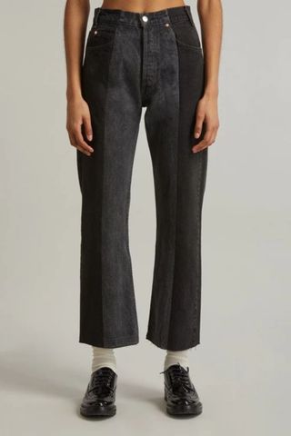 galentine's day gift ideas - woman wearing faded black jeans with contrast denim detail