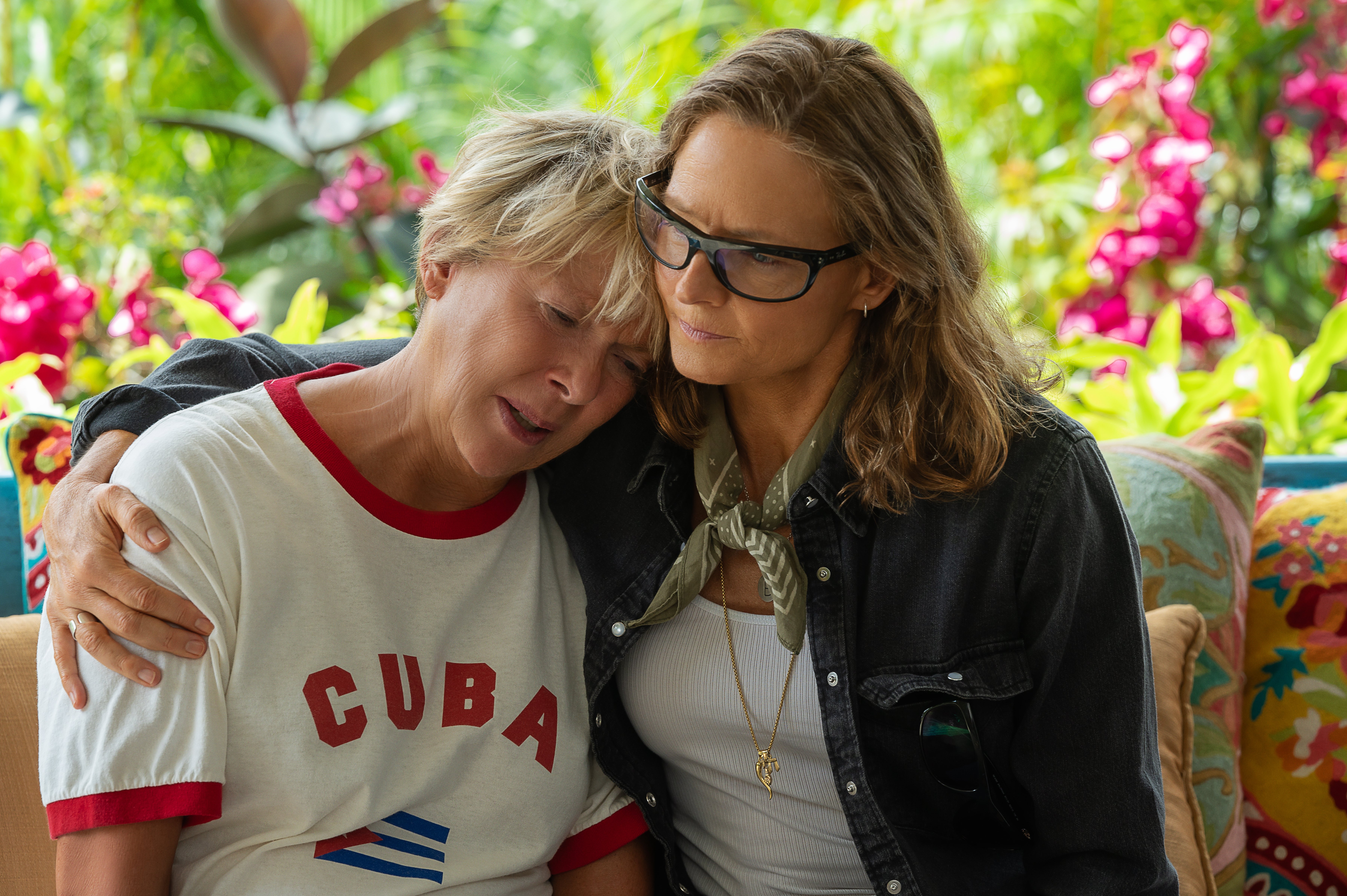 annette benning as nyad and jodie foster as her friend hugging her in a still from the movie nyad