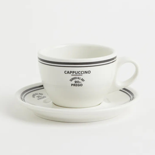 A white and black cappuccino mug and saucer set