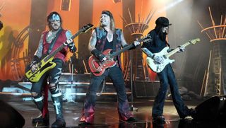 (from left) Nikki Sixx, Vince Neil and Mick Mars of Mötley Crüe perform onstage at Nationals Park on June 22, 2022 in Washington, DC