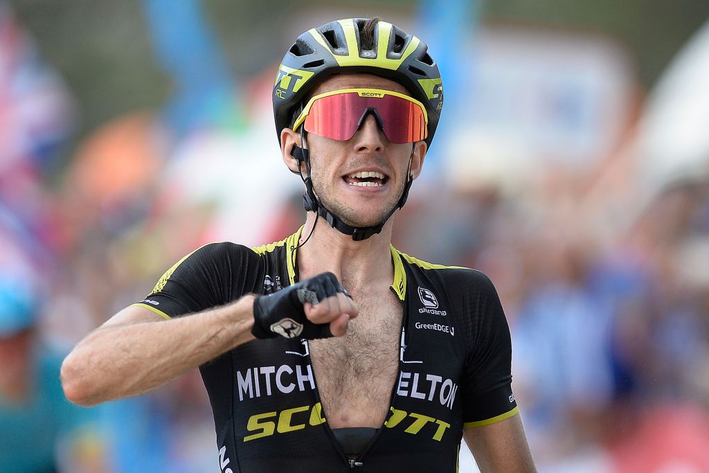 Simon Yates celebrates his win on stage 14