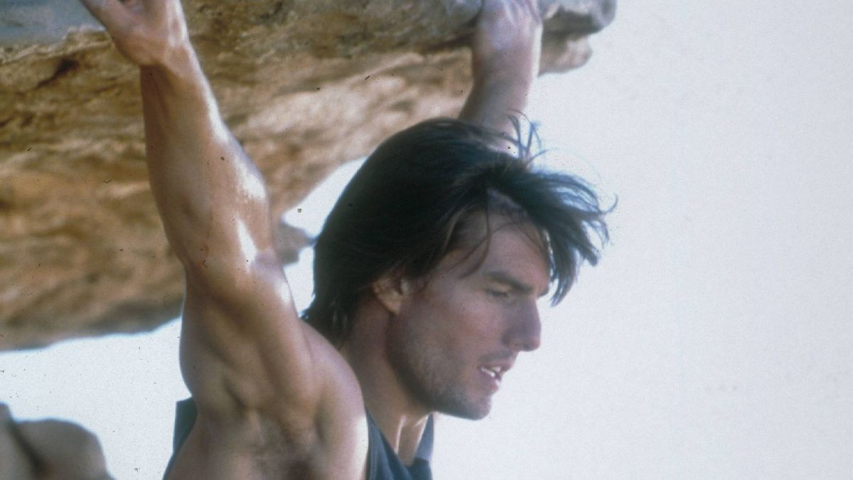 Tom Cruise in Mission: Impossible 2 hanging from a cliff