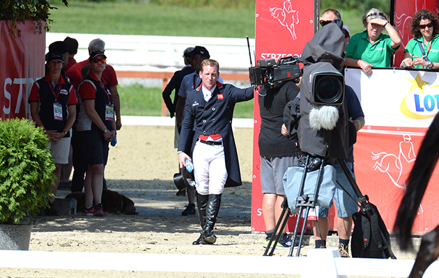Team spirit: Oliver Townend keeps a close eye on the first day of action