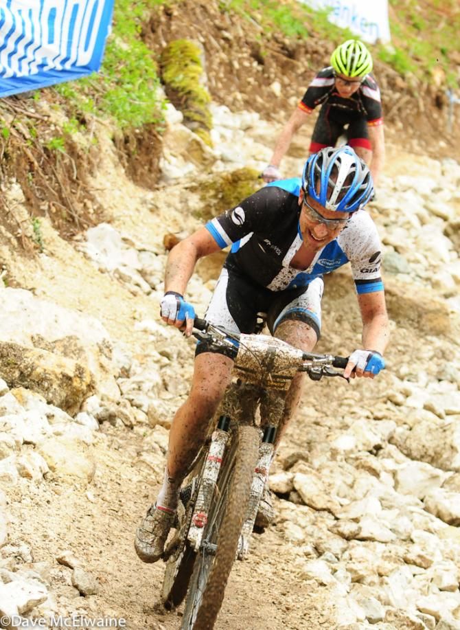 Fabian Giger (Giant Pro XC Team) descending through a rock garden