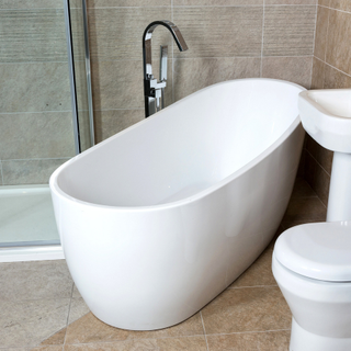 Belfry Freestanding Bath in a bathroom in between a toilet and shower