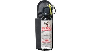 bear deterrent spray with safety tab on