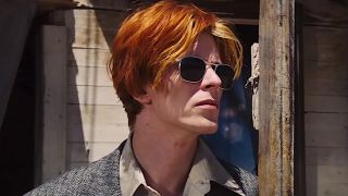 a red-haired man wearing sunglasses