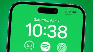 An iPhone on a green background showing Spotify's new iPhone widget