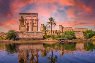 The temple of Philae in Aswan, Egypt, seen from the Nile River.