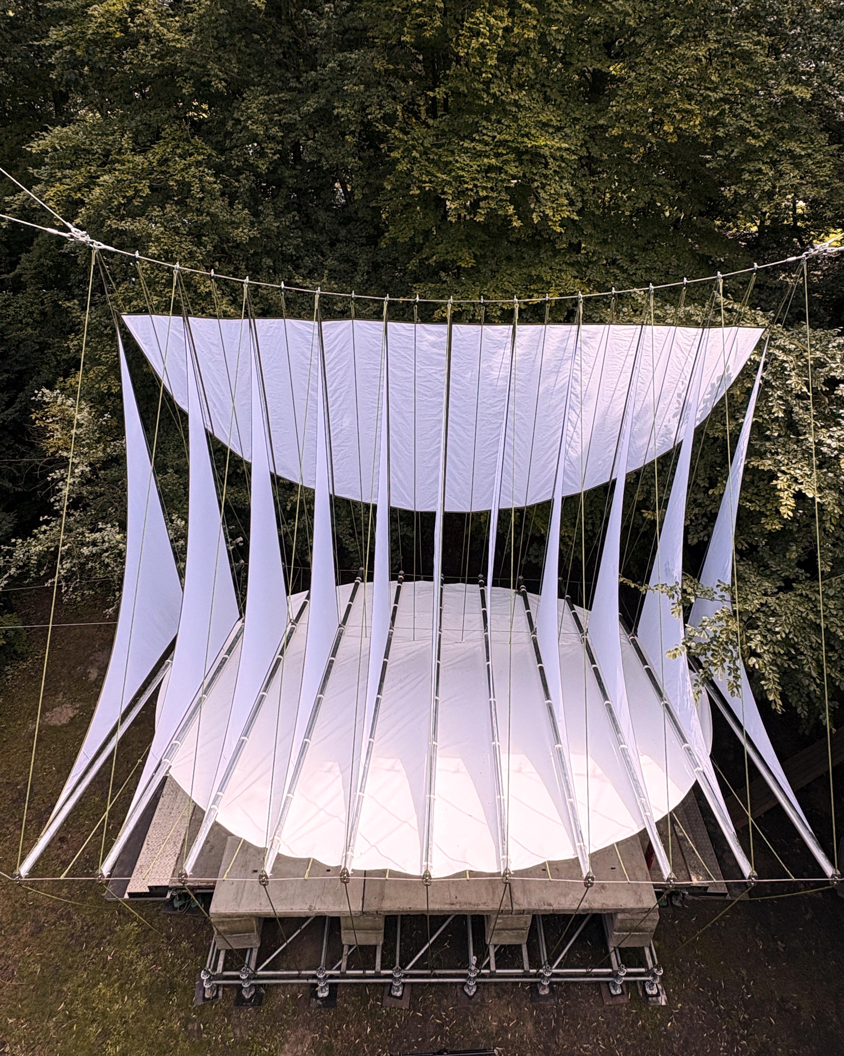 At Dekmantel Festival, a white tent over a stage in the woods