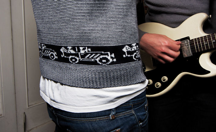 Black and white stripy knitted jumper with truck design