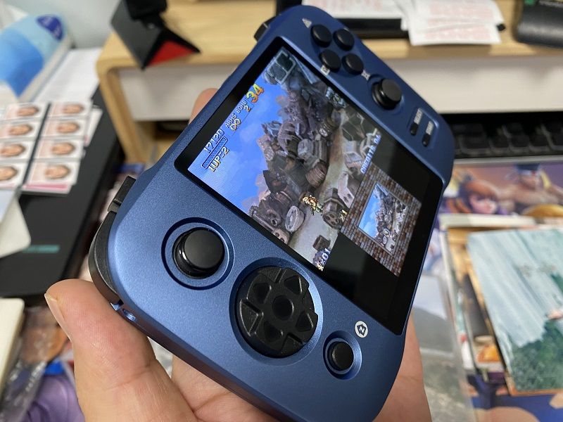 Someone holding the LG Wing handheld gaming console.