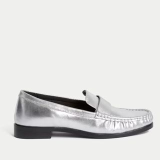 flat lay image of silver loafers