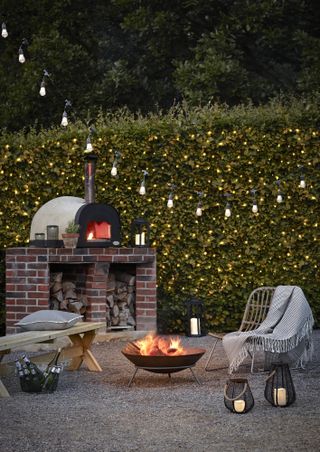 outdoor lighting festoons and hedge fairy lights from lights4fun with pizza oven