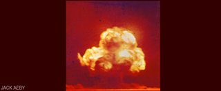 The only color photograph available for the Trinity blast, taken by Los Alamos scientist and amateur photographer Jack Aeby from near Base Camp. As Aeby later said, "It was there so I shot it."