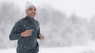 Six ways to keep exercising in winter: image of running man in snow