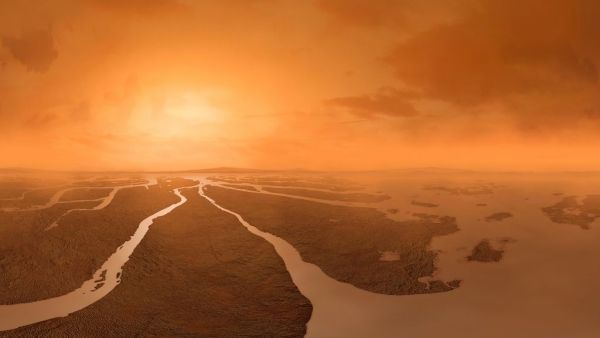 An illustration depicts Titan&#039;s dense yellowish atmosphere above a river of methane on the moon surface