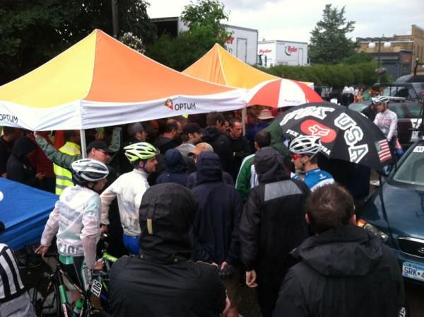 Riders and race officials try to take shelter