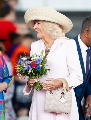 Queen Camilla wearing a Lady Dior bag