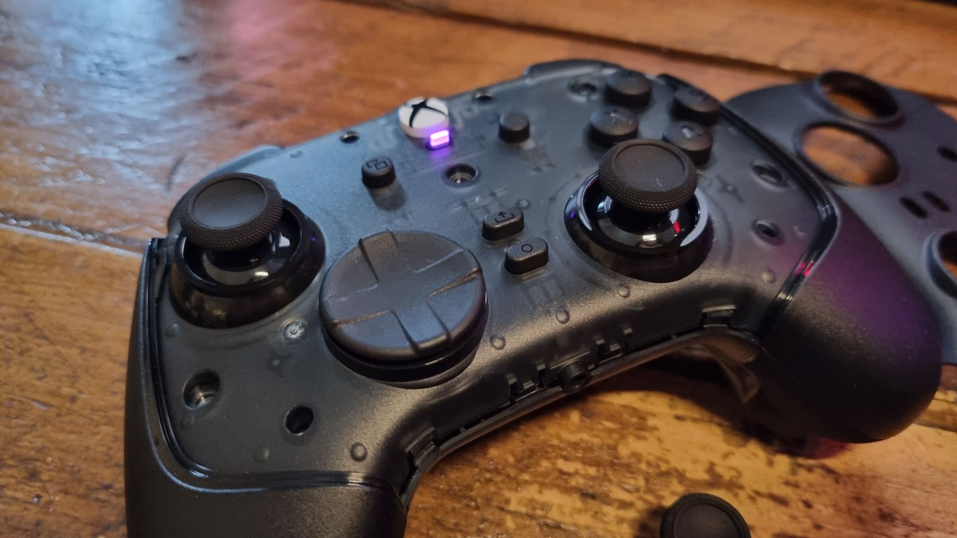 The Razer Wolverine V4 Pro with its front magnetic faceplate removed