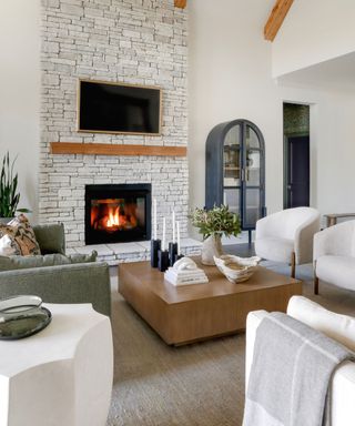 Neutral living room with stone fireplace