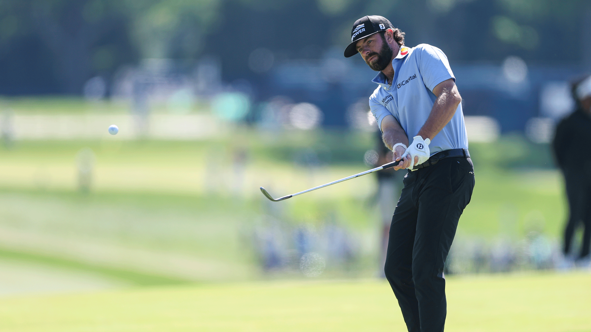 Cameron Young chips during a practice round at Aronimink ahead of the 2026 PGA Championship
