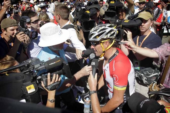 Lance Armstrong speaks to the media
