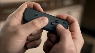 Nintendo Joy-Con in hand