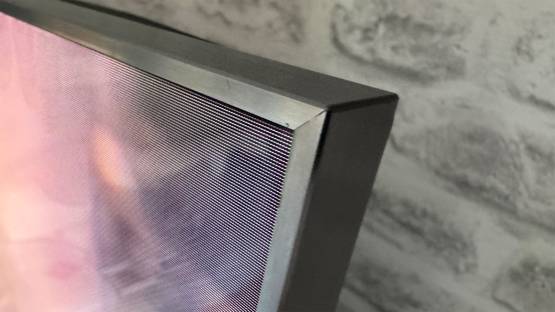 TCL C8K 85-inch TV close up on top right corner of set