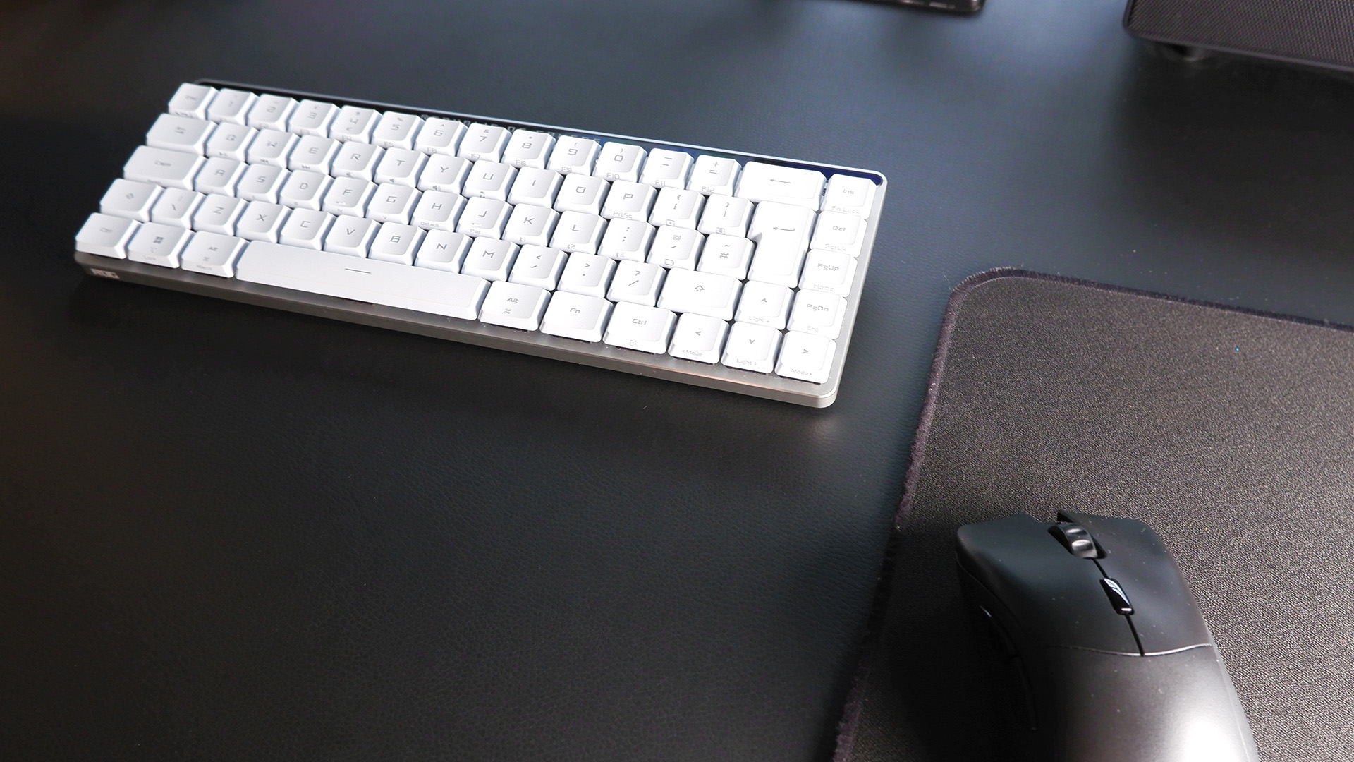 The ROG Falchion RX gaming keyboard in white set up on a desk.
