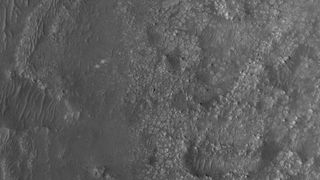 This image, snapped on March 31, 2022, from the HiRISE camera aboard the Mars Reconnaissance Orbiter shows NASA's Perseverance rover and Ingenuity helicopter on Mars.