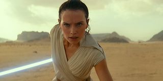 Rey in a stance ready to flip and strike at an incoming TIE fighter
