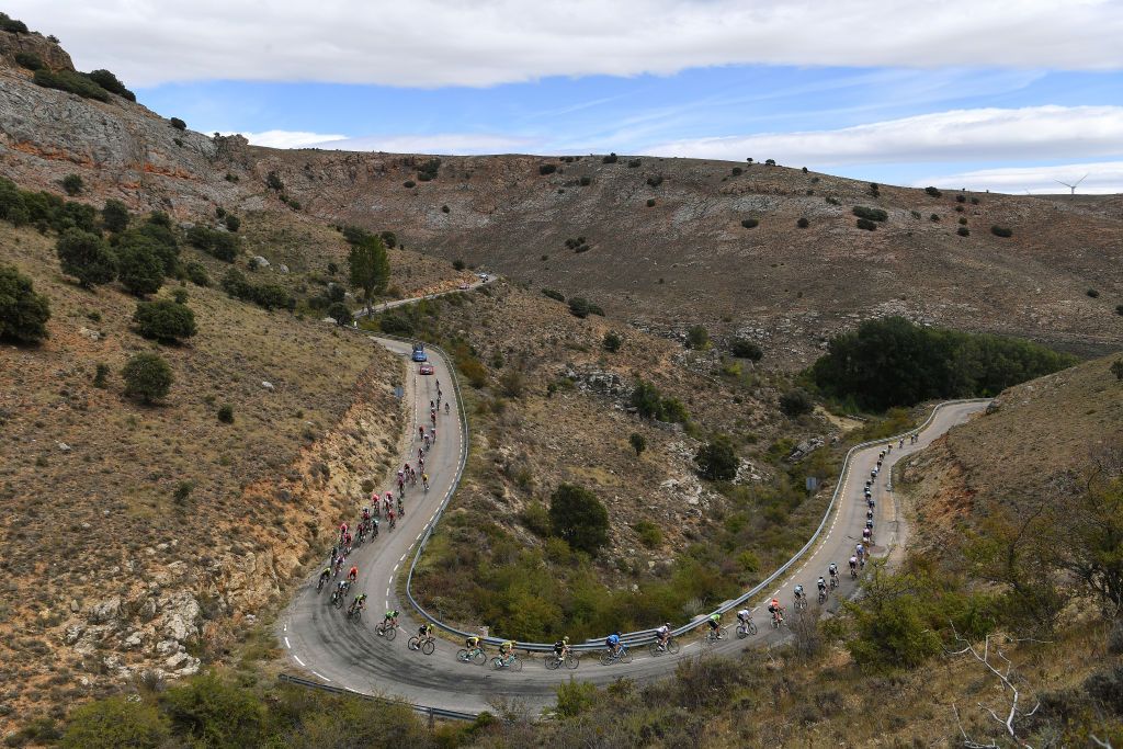 The peloton snaking down a descent on stage 17