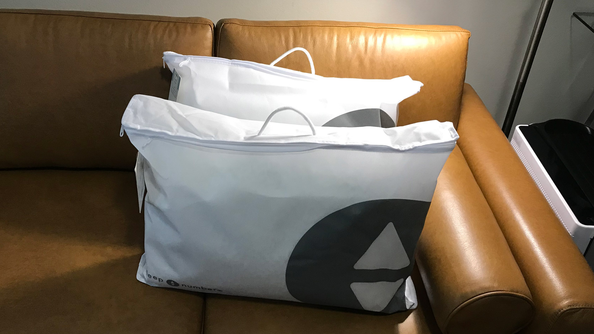 A pair of Sleep Number ComfortFit Pillows in plastic bags