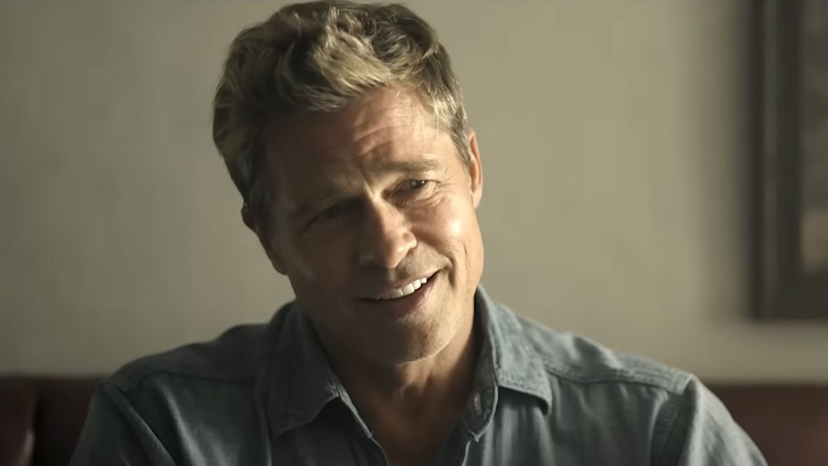 Brad Pitt smiling in collared shirt in F1 film 