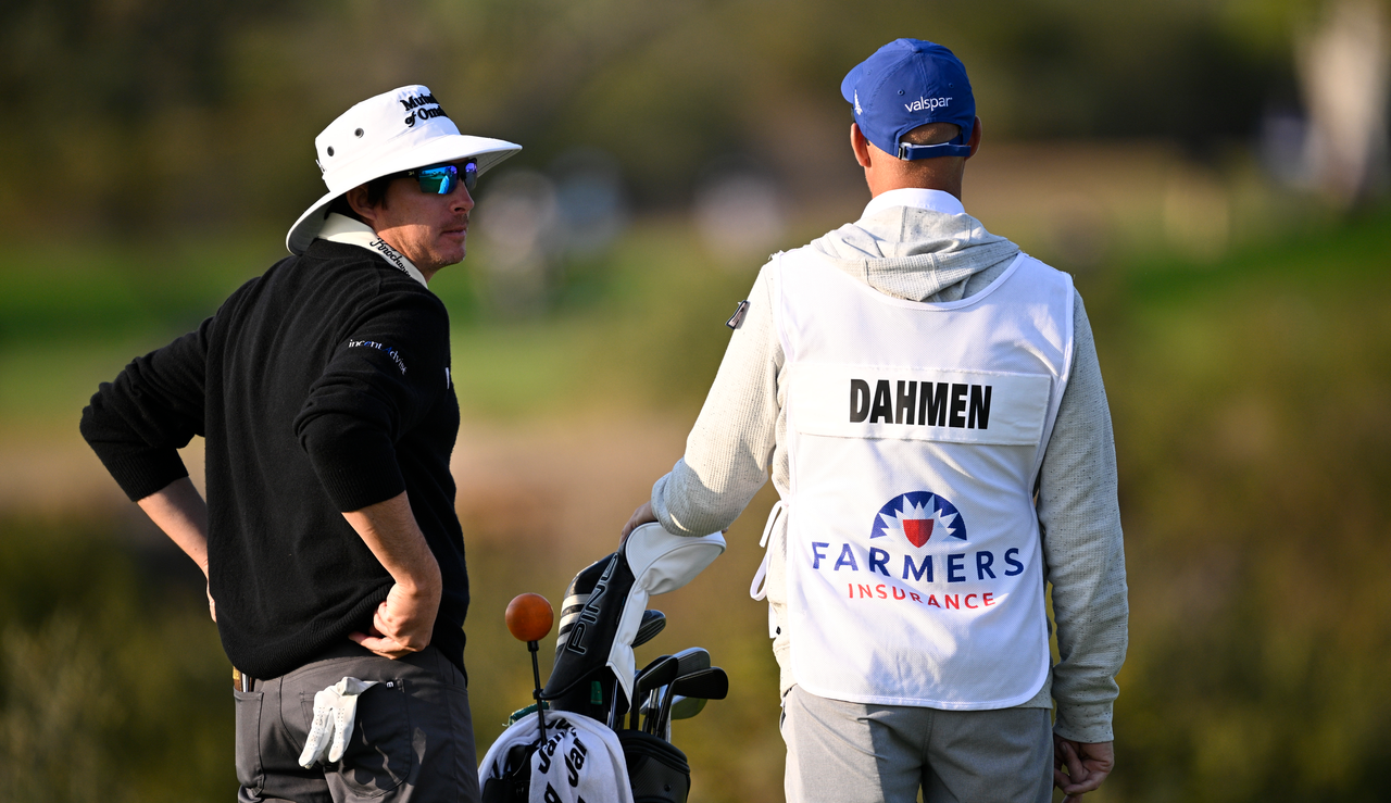 Joel Dahmen chats to his caddie during the Farmers Insurance Open