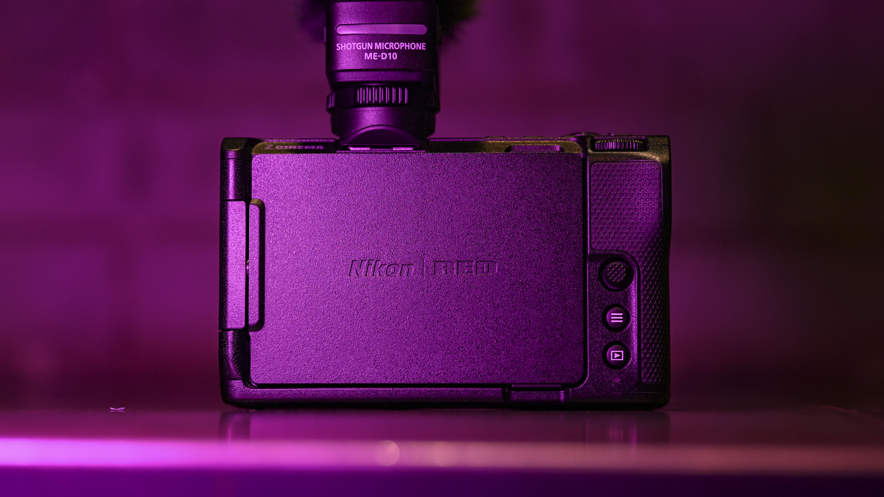 Back of the Nikon ZR camera under low key magenta lighting