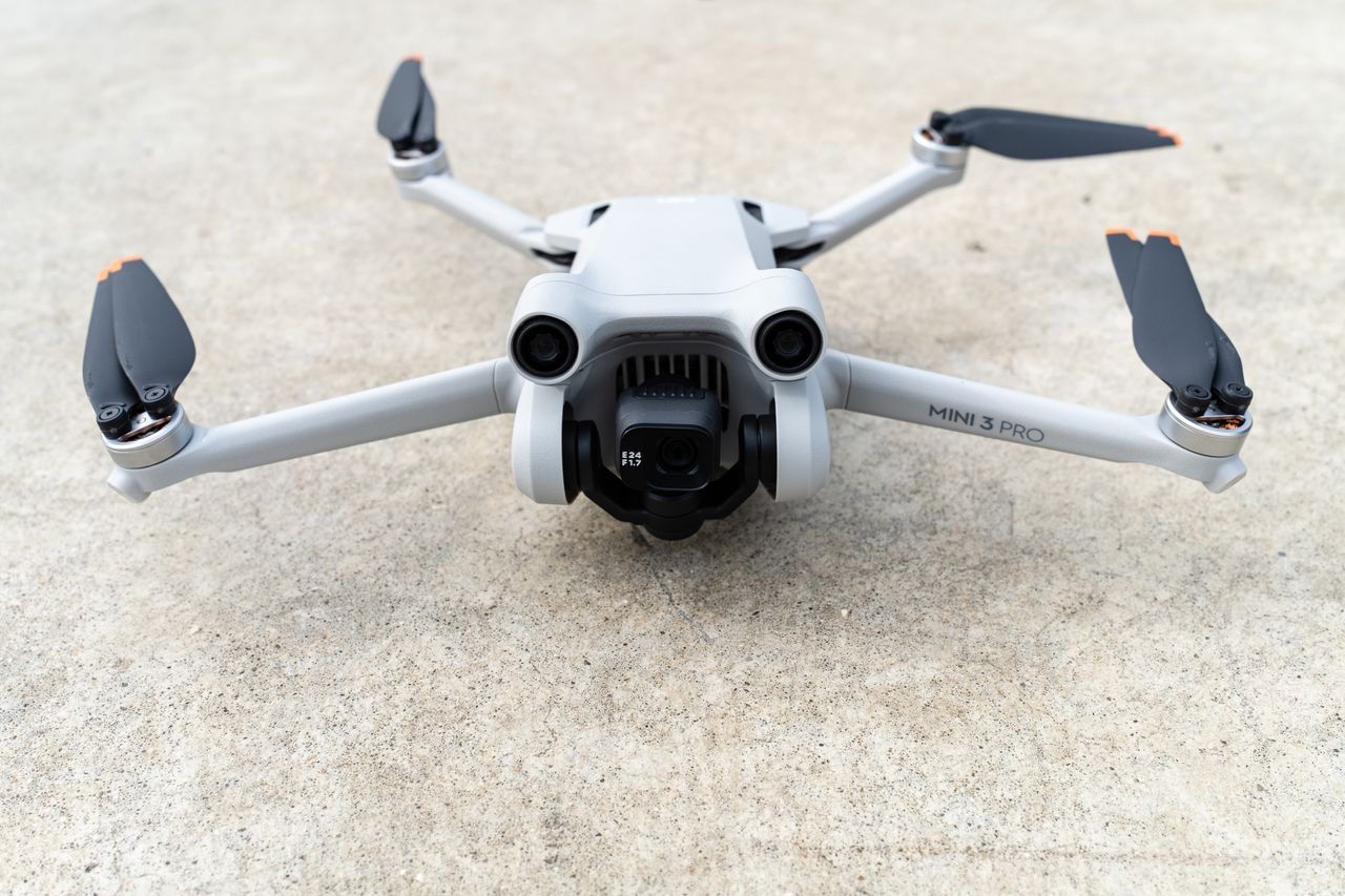 The DJI Mini 3 Pro drone resting on the ground
