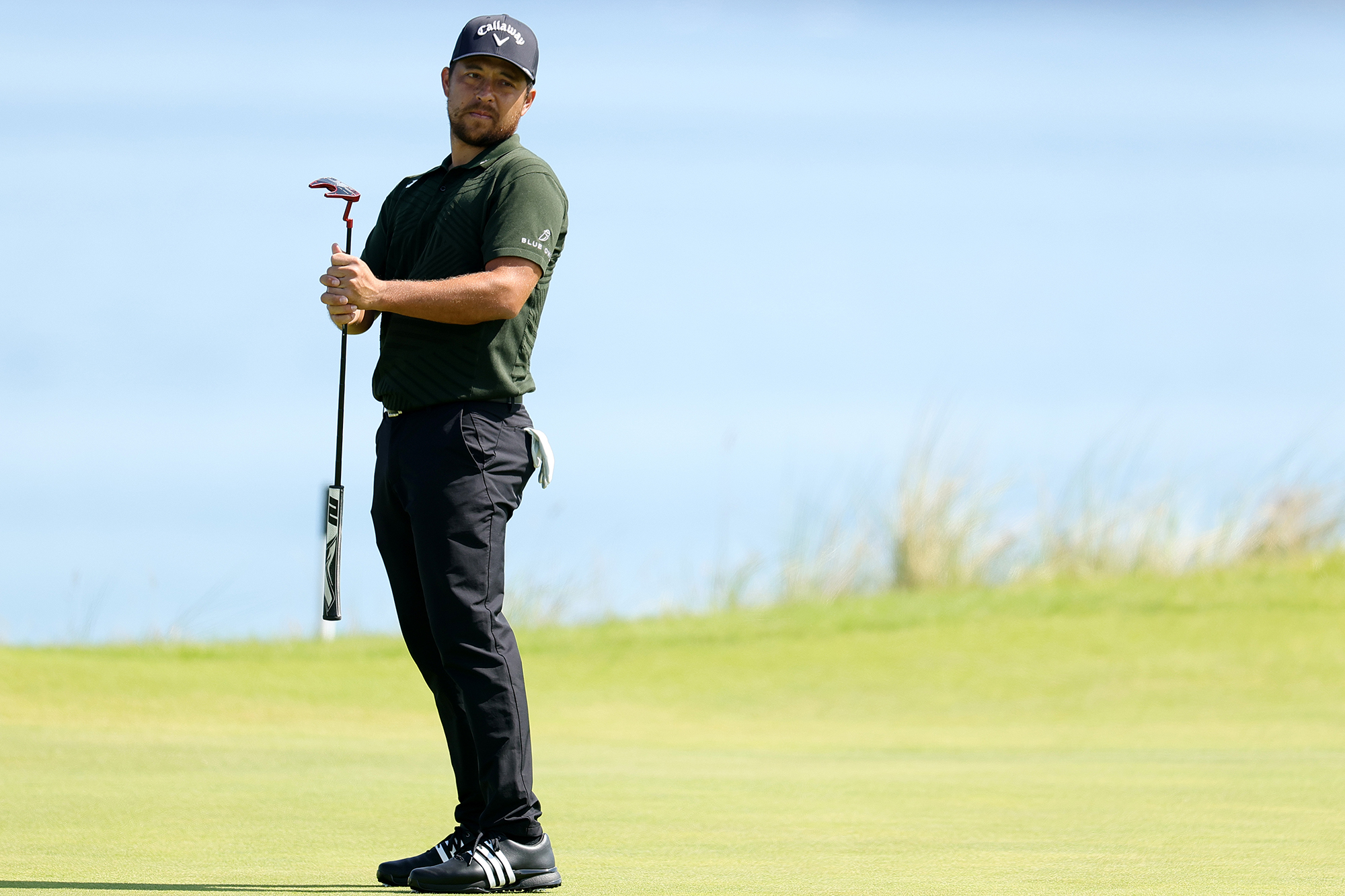 Xander Schauffele reacting to a putt on the green at Royal Portrush