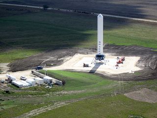 Grasshopper consists of a Falcon 9 rocket first stage, Merlin 1D engine, four steel landing legs with hydraulic dampers, and a steel support structure. For a sense of its scale, note the blue pick-up truck to the left of Grasshopper in the photo above.