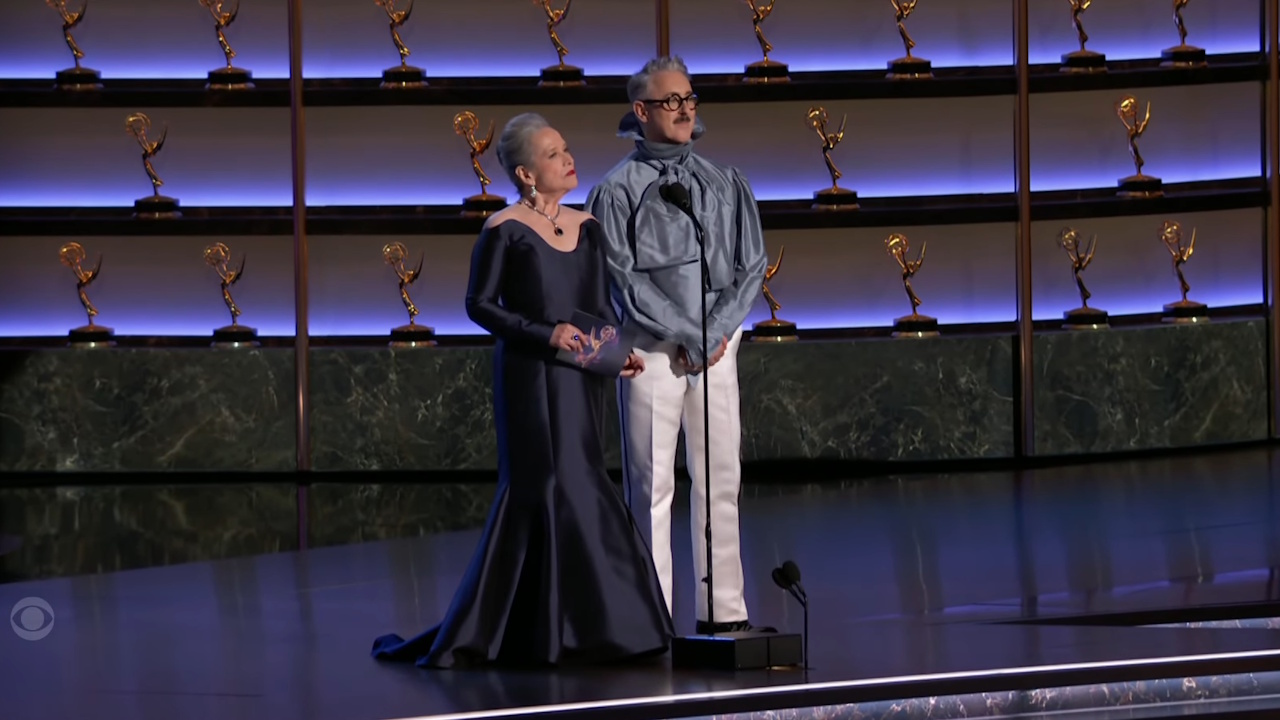 Kathy Bates and Alan Cumming present an award at the 2025 Emmys.