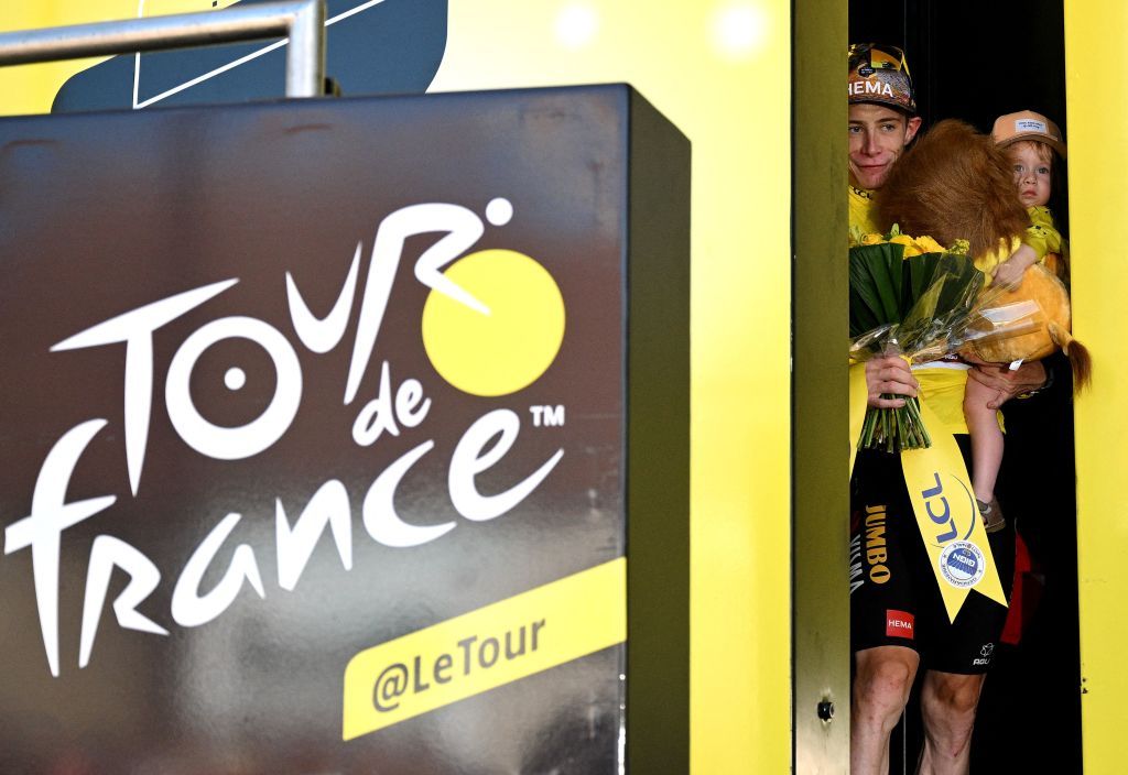 JumboVisma teams Danish rider Jonas Vingegaard celebrates with the overall leaders yellow jersey on the podium after the 20th stage of the 109th edition of the Tour de France cycling race 407 km individual time trial between LacapelleMarival and Rocamadour in southwestern France on July 23 2022 Photo by Marco BERTORELLO AFP Photo by MARCO BERTORELLOAFP via Getty Images