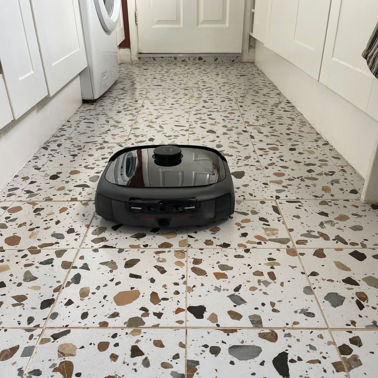 Eufy Robot Vacuum Omni E25 on terrazzo tiles in a kitchen