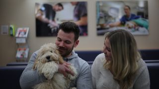 Monti the cockapoo with his owners in The Supervet: Puppy Special