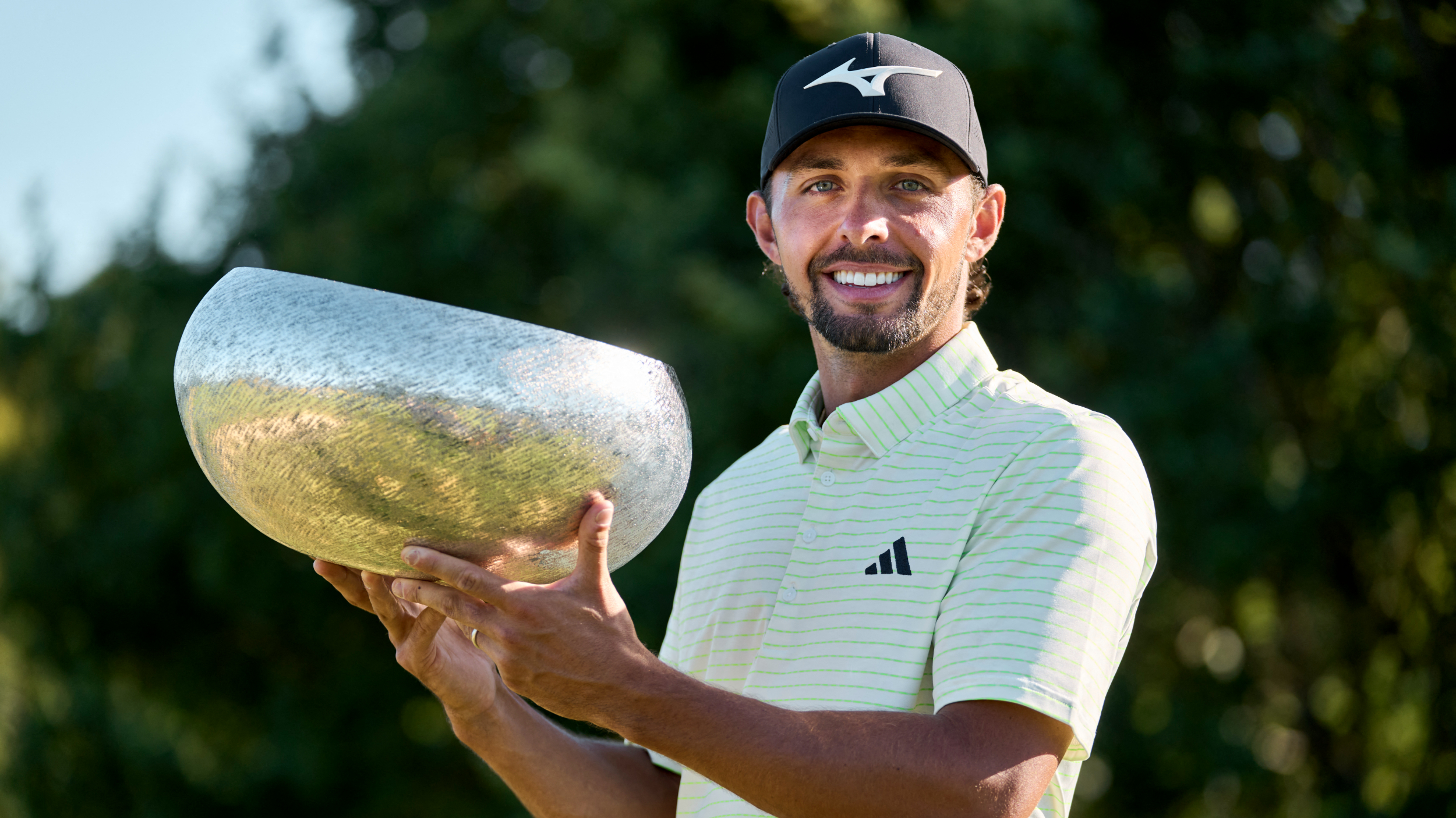 Marco Penge and the Danish Golf Championship trophy