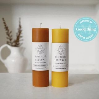 pair of orange and yellow pillar candles