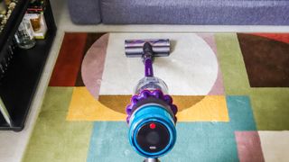 Dyson Gen5detect being used on a rug