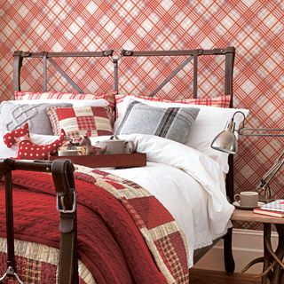 bedroom with red tartan wallpaper on wall