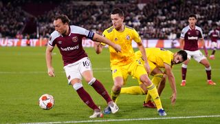 West Ham United’s Mark Noble (left) and Dinamo Zagreb’s Daniel Stefulj in action during the UEFA Europa League, Group H match at London Stadium, London. Picture date: Thursday December 9, 2021