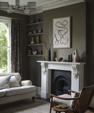 traditional living room with modern decor, greige walls, white fireplace and artwork